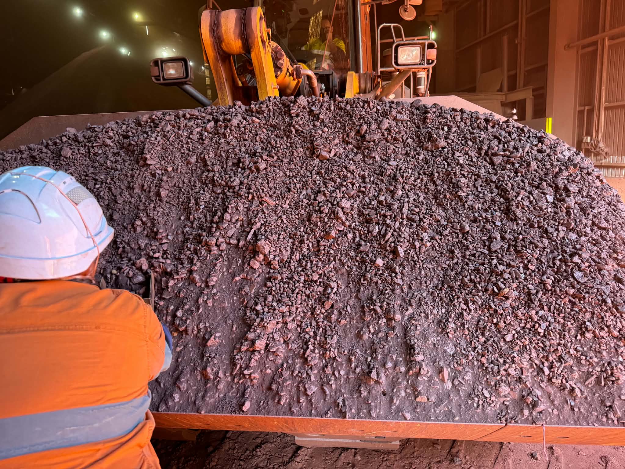 Sampling work underway beside bulk material